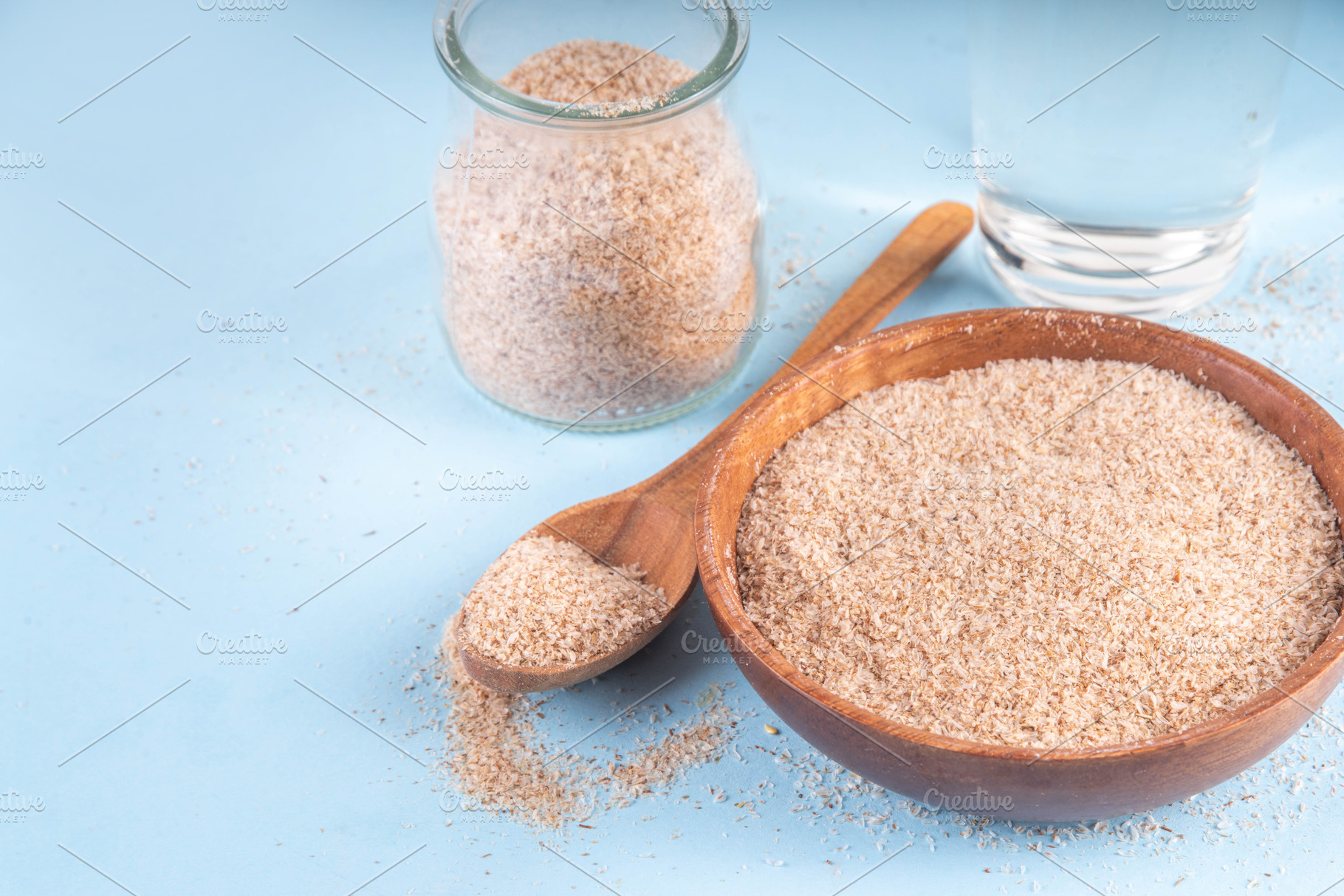 Whole Psyllium Husk in spoon, bowl and jar, with glass of water, a Food & Drink Photo by Rimma