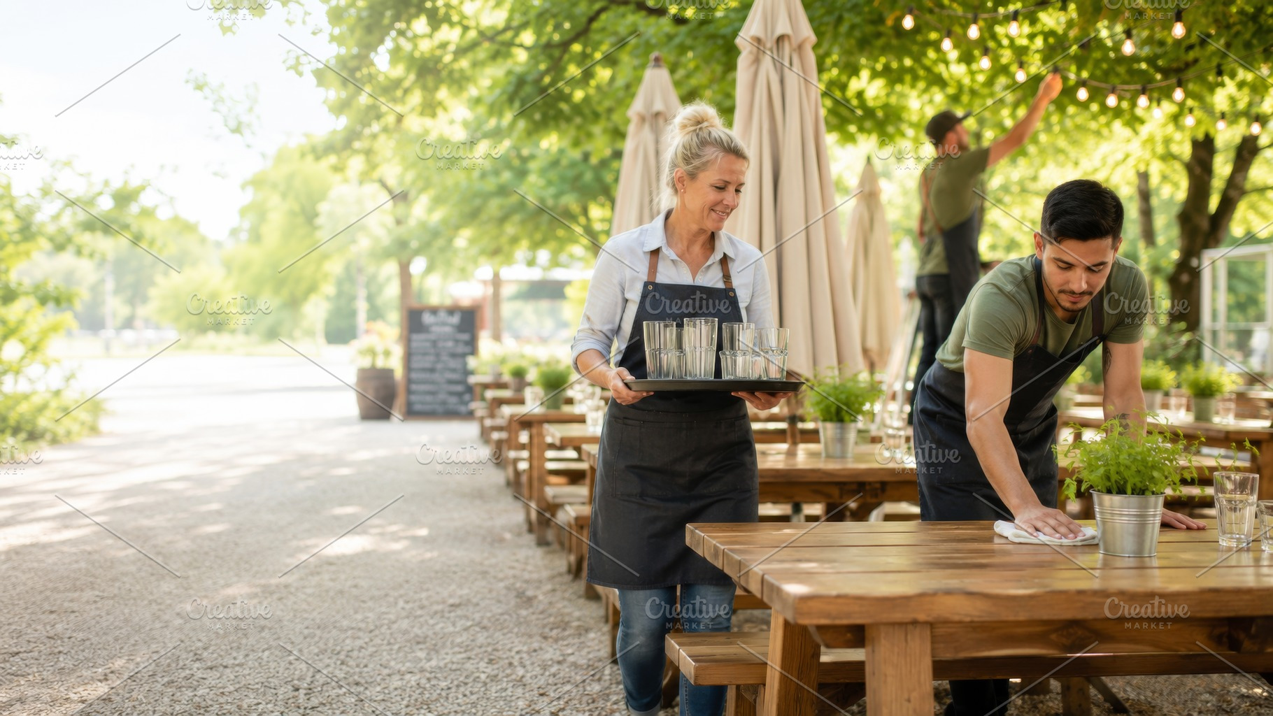 Outdoor restaurant staff setting up, a Photo by Dvoevnore photos