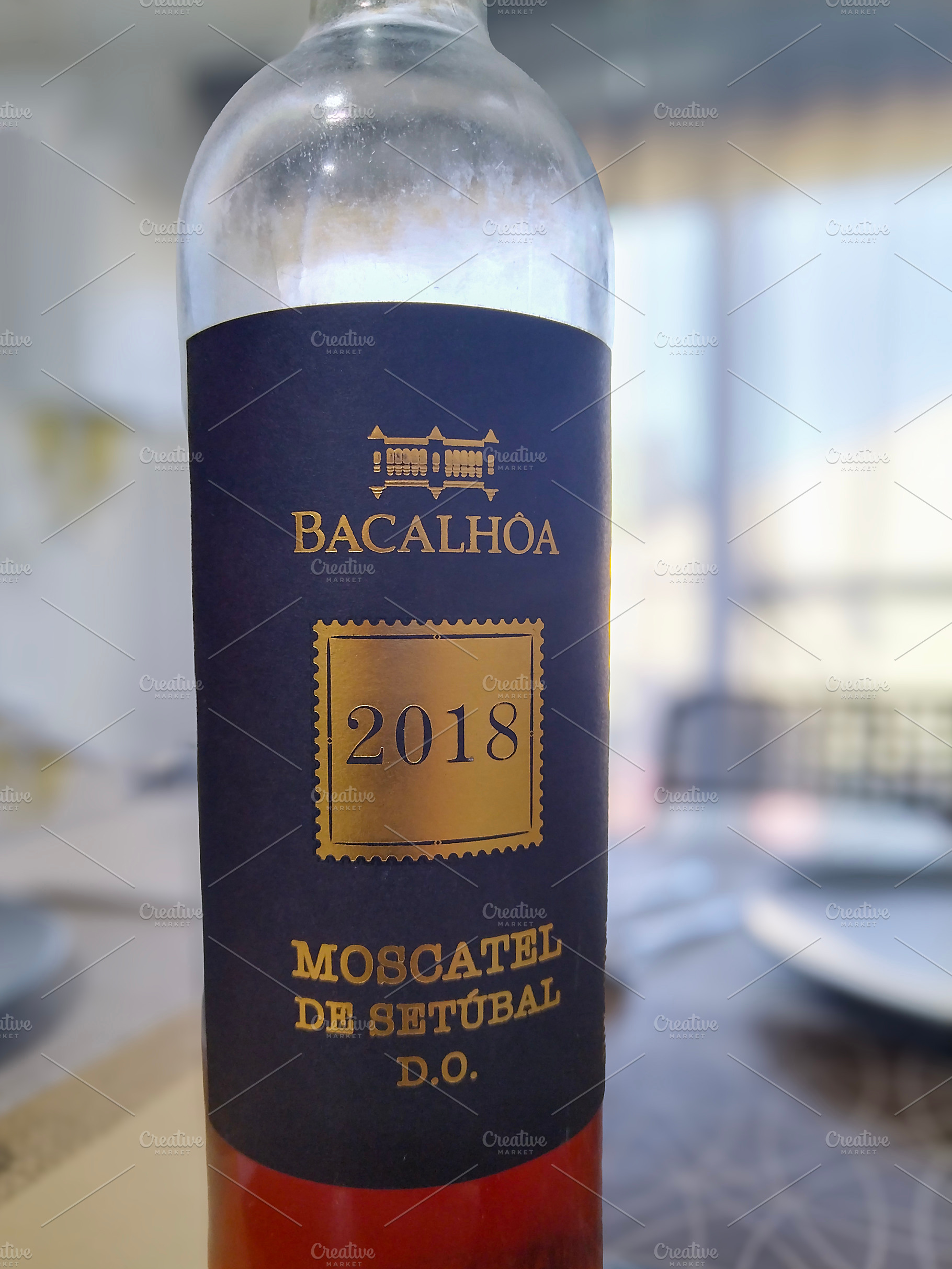 Bacalhoa moscatel de setubal wine bottle on dining table, a Food & Drink Photo by DanFLCreativo
