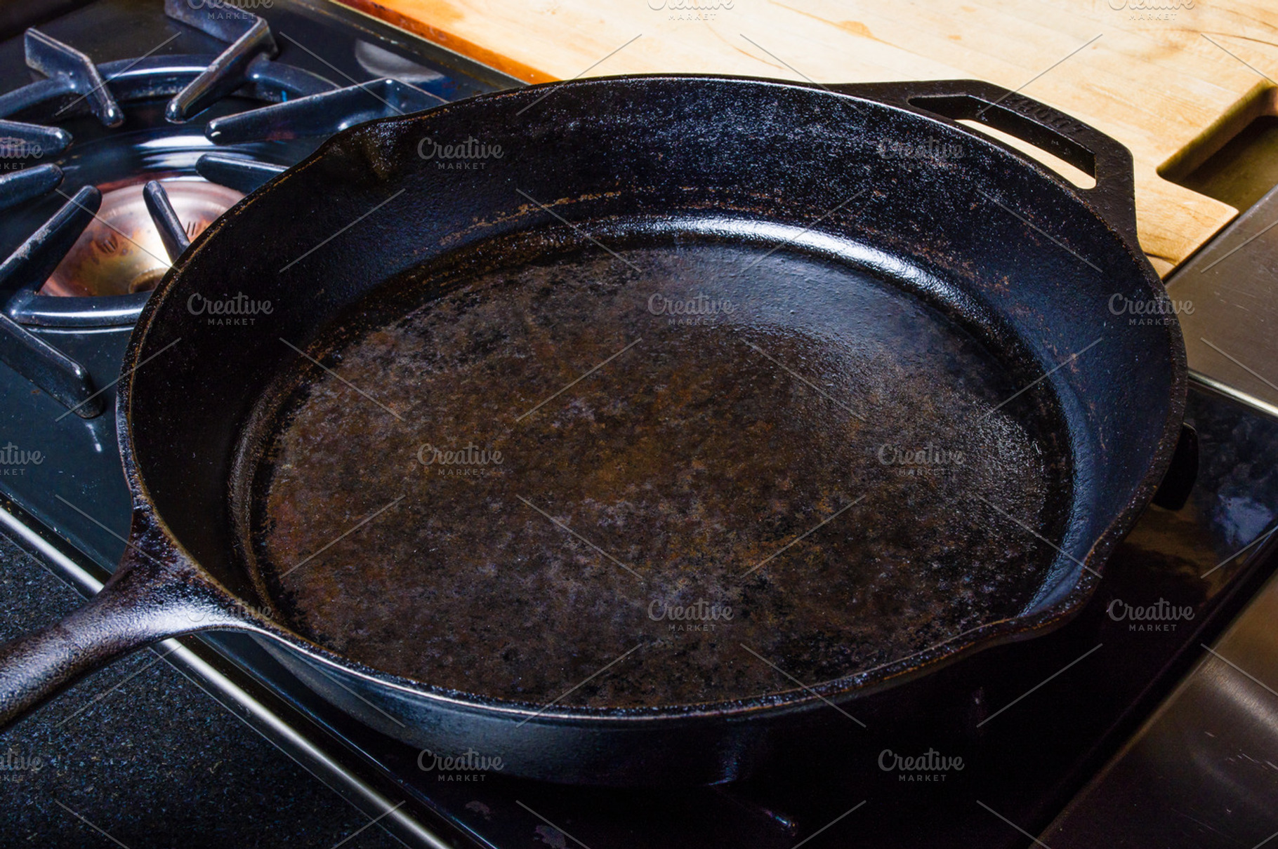Cast iron skillet on stove, a Food & Drink Photo by Zigzag Mountain Art