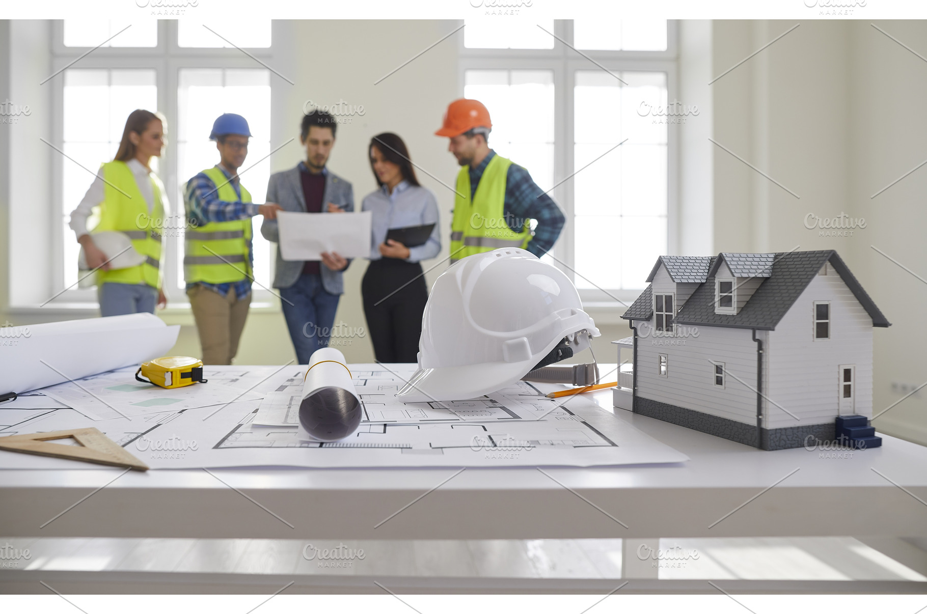 Engineers and architects standing on, a Business Photo by StudioRomantic