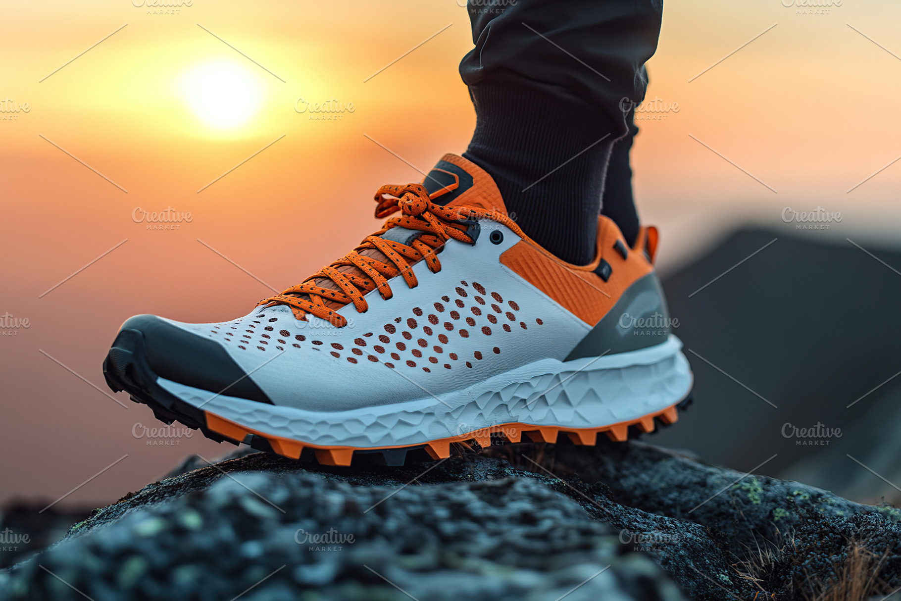 Trail shoes on a male foot against a sunset backdrop in an outdoor environment, a Sports & Recreation Photo by AlyaAnd