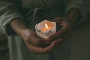 Woman holds candle