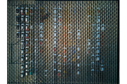Aerial view of a massive parking lot, an Industrial Photo by HalfPoint