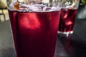 Glass of red beverage, an Architecture Photo by DanFLCreativo