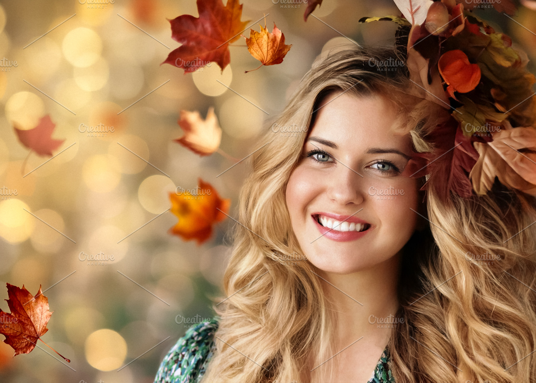 Attractive blonde woman smiling with autumn leaves in her hair a, a Person Photo by Studio ANNA