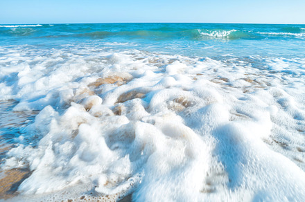 Tropical beach with sea stock photo containing beach and sand, a Nature Photo by Vapi