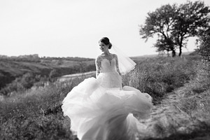 bride blonde girl with a bouquet in the forest, a Person Photo by Weddings, People, Travel