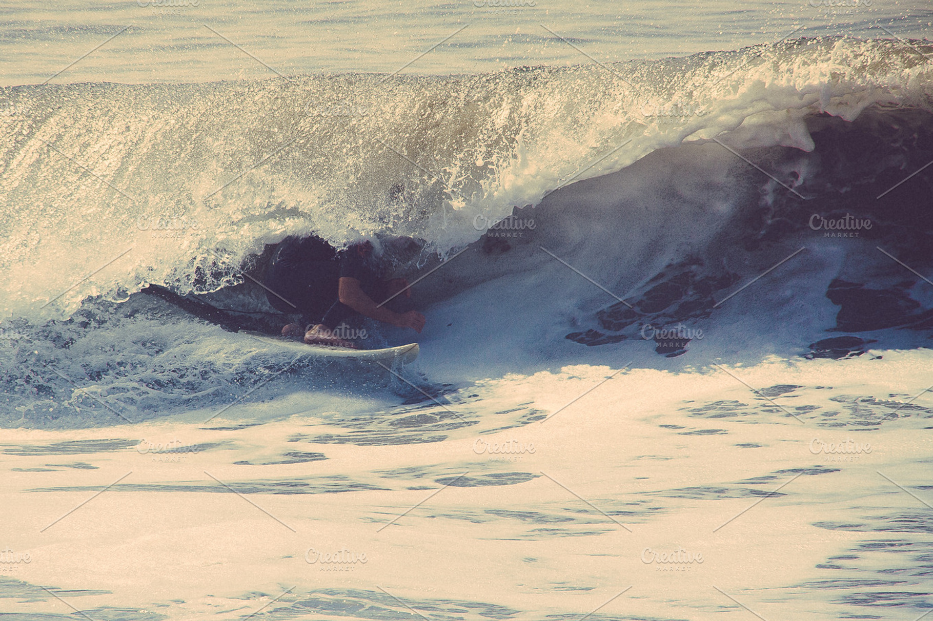 Surfer in a barrel containing vintage, surfer, and surfing
