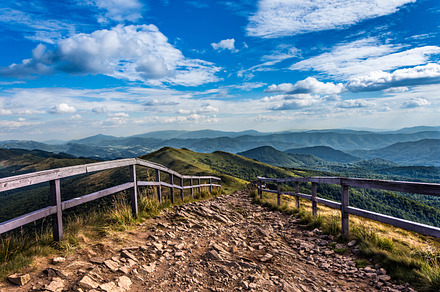 Mountain trail featuring handrails, landscape, and nature