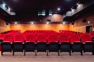 Empty cinema hall with red seats, an Architecture Photo by SkyNext