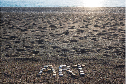 Word art made from stones on sandy, an Arts & Entertainment Photo by Koldunov