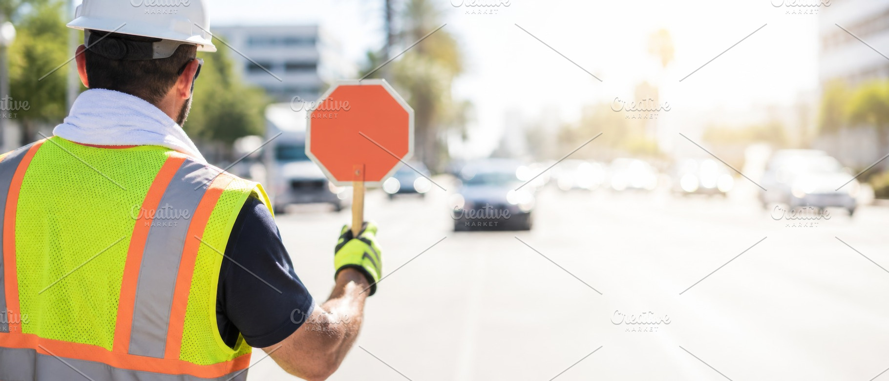 Construction worker holding stop sig, a Photo by Dvoevnore photos