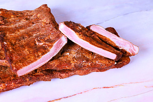 Dried smoked ribs meat slices on