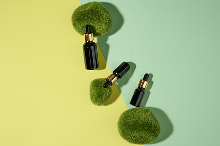 glass cosmetic brown bottles with a pipette on a green-yellow ba, a Beauty & Fashion Photo by ndanko