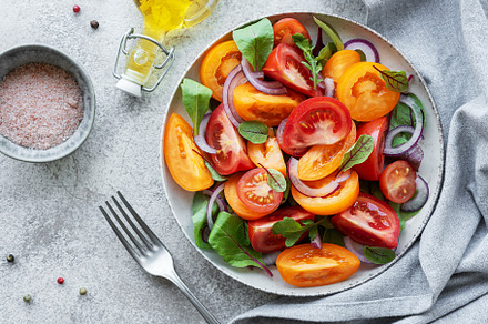 Green salad from leaves and tomatoes, a Food & Drink Photo by Olena Rudo