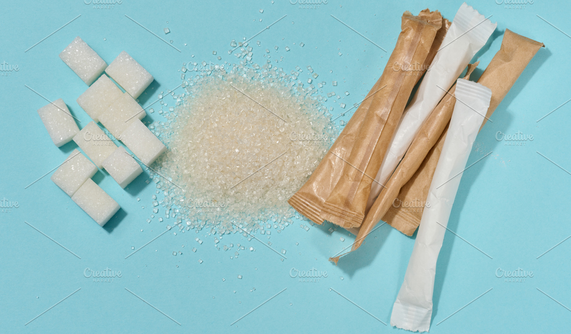 Different types of refined sugar cubes, scattered crystals and p, a Food & Drink Photo by ndanko