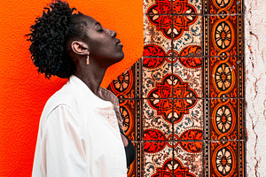 Profile by Orange Tile Wall, a Person Photo by SkyNext