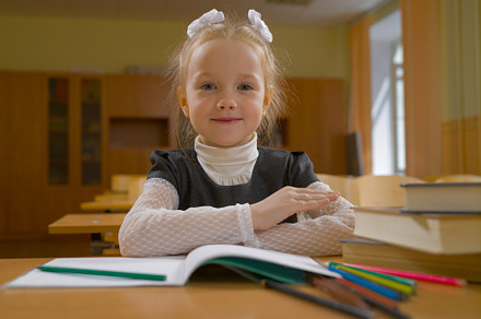 Little girl in school class at the l containing girl, school, and kid, a School & Education Photo by oleghz