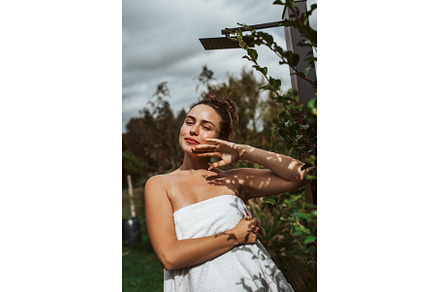 Beautiful woman touching her face, a Beauty & Fashion Photo by HalfPoint
