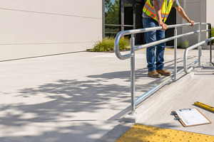 Construction workers install handrai, a Photo by Dvoevnore photos