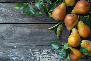 Red pears with leafs and copyspace for text on wooden table, a Food & Drink Photo by AlyaAnd