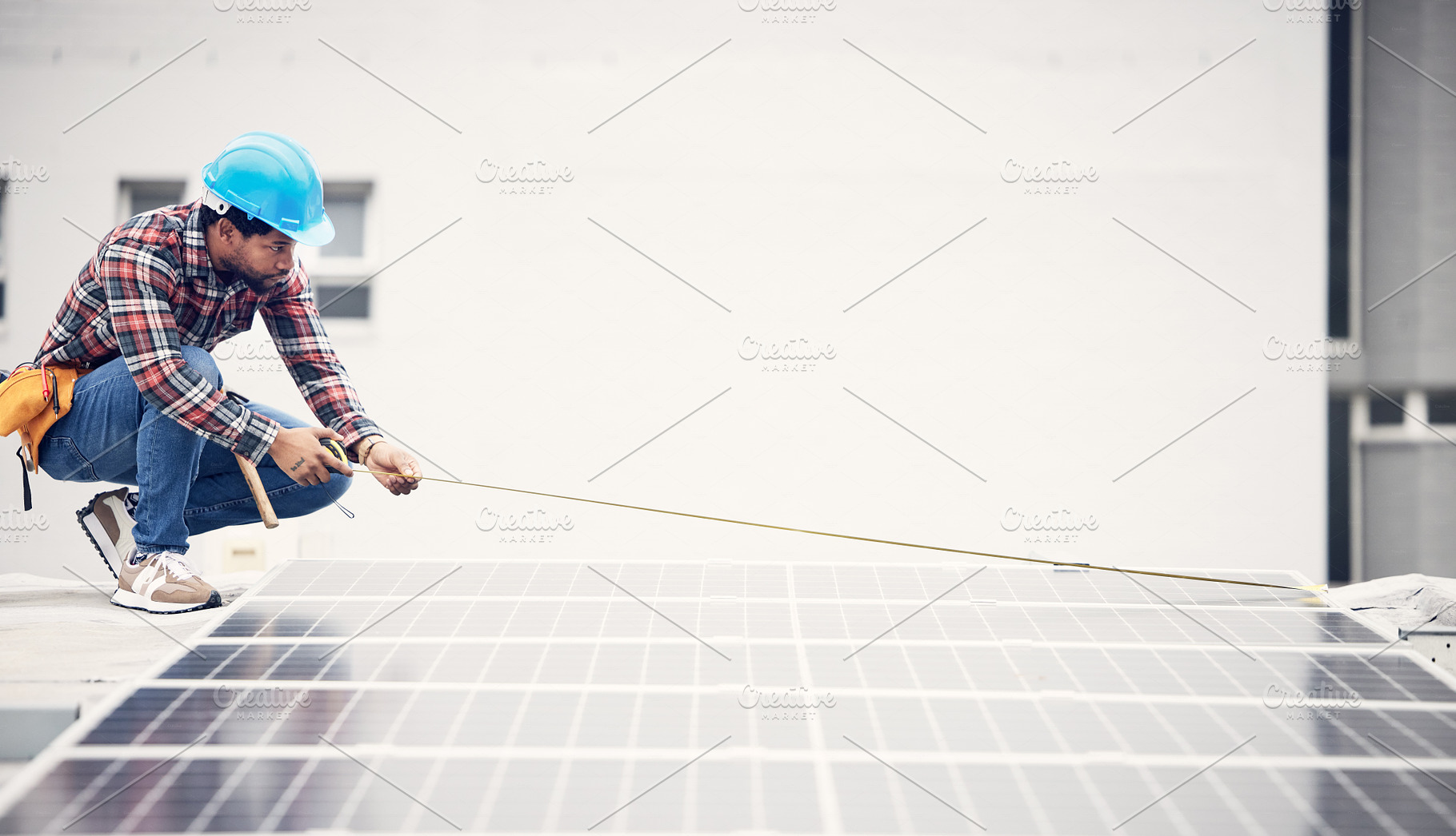 Solar panel installation, ruler or man measure photovoltaic cell, eco sustainability grid or renewable energy plate. Rooftop inspection, green power supply and male engineer check electricity cell, a Photo by Peopleimages.com