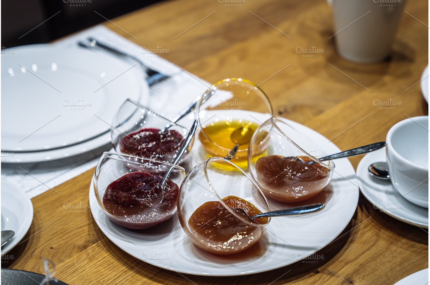 Assorted fruit jams and honey served, a Food & Drink Photo by Red Hot Chili Pepper Shop