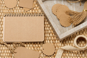 Blank notepad and various craft supplies made of recycled paper, a Background Photo by ndanko