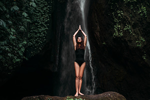 Young woman practicing yoga containing balance, bali, and bali indonesia