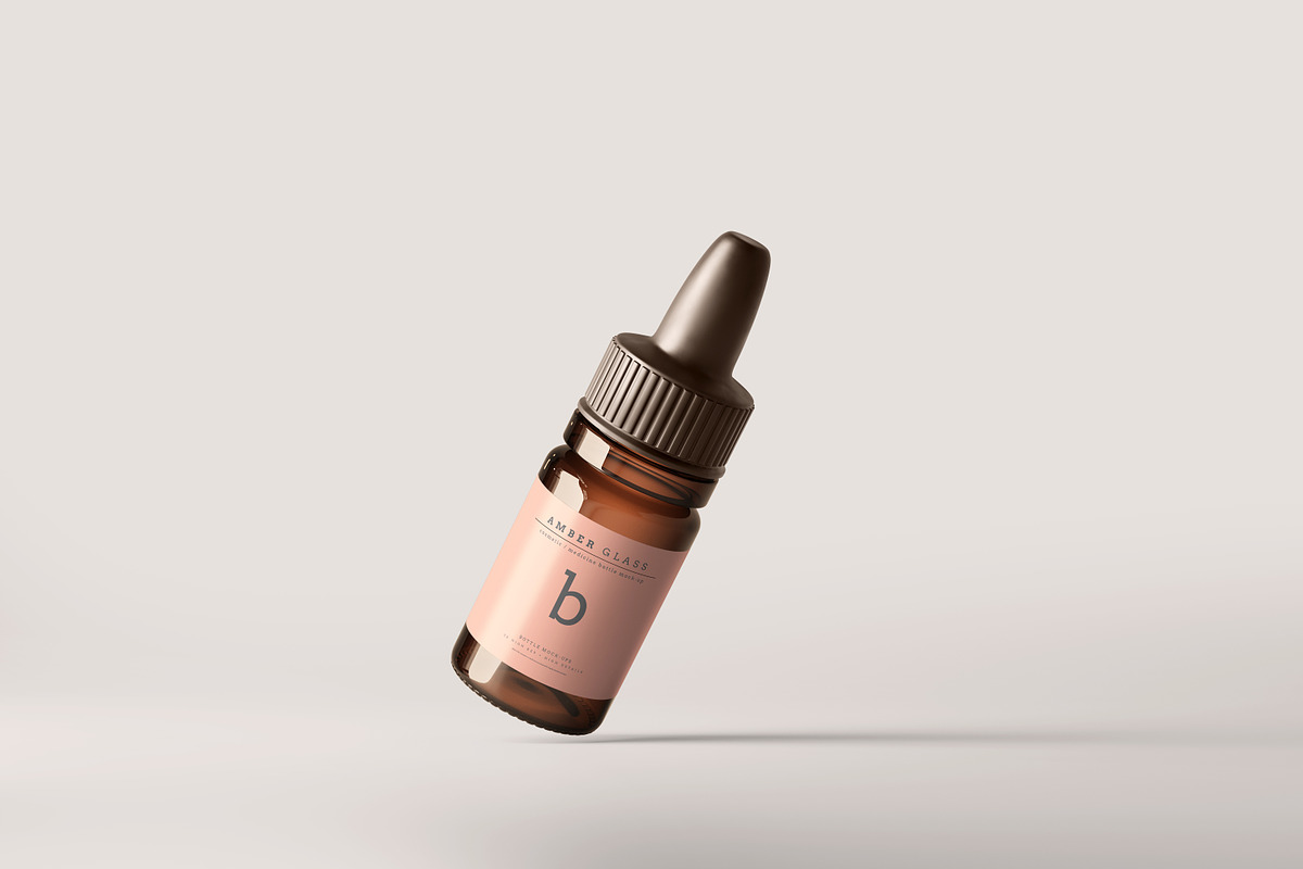 Amber Glass Dropper Bottle Mockups, a Cups & Container Mockup by pmvch (Photo 9 of 20)