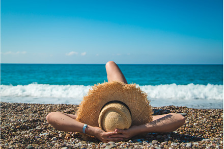 Woman at the sea in a hat. Selective, a Person Photo by yanadjana
