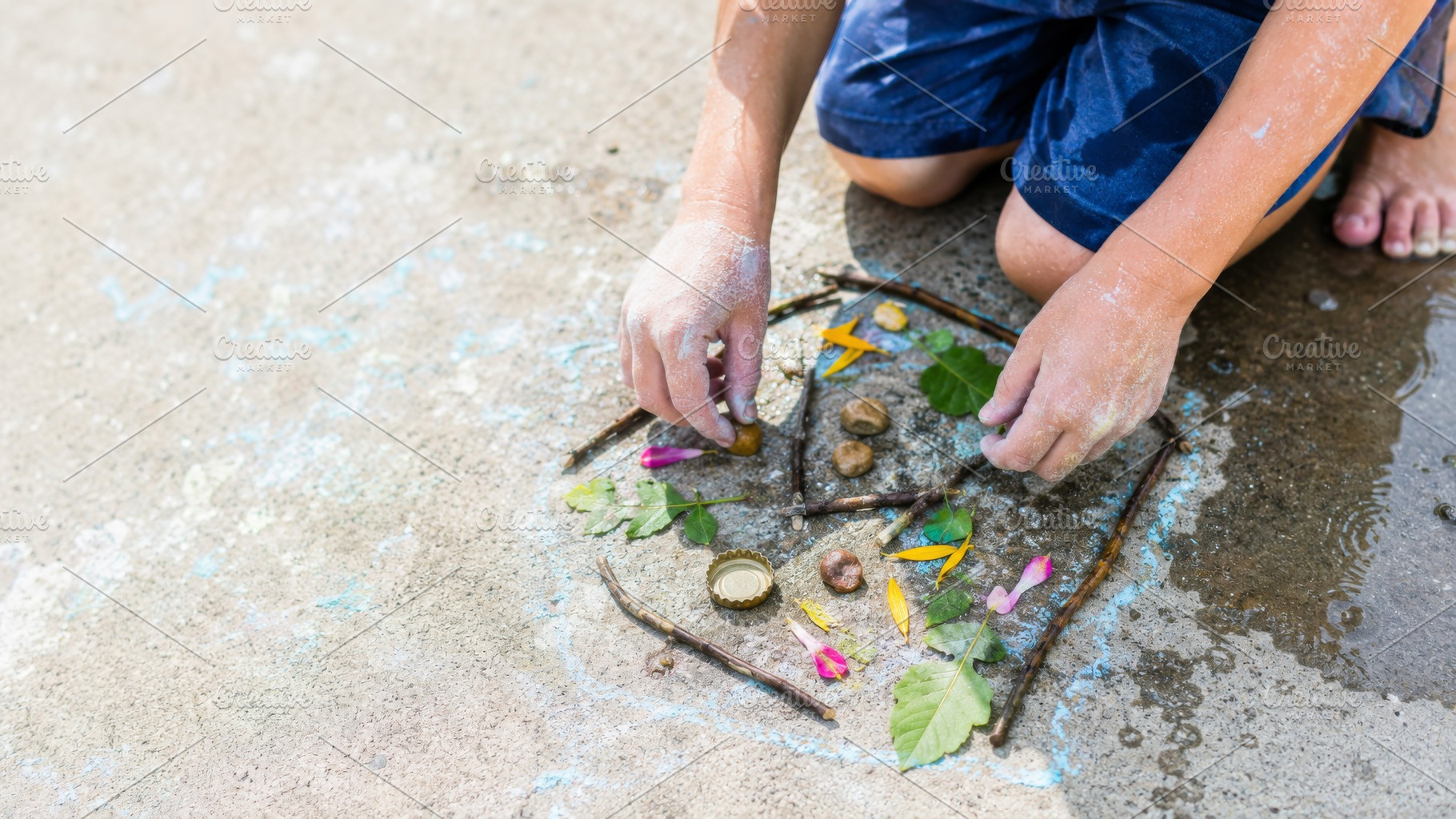 Child playing outside with natural m, a Photo by Dvoevnore photos