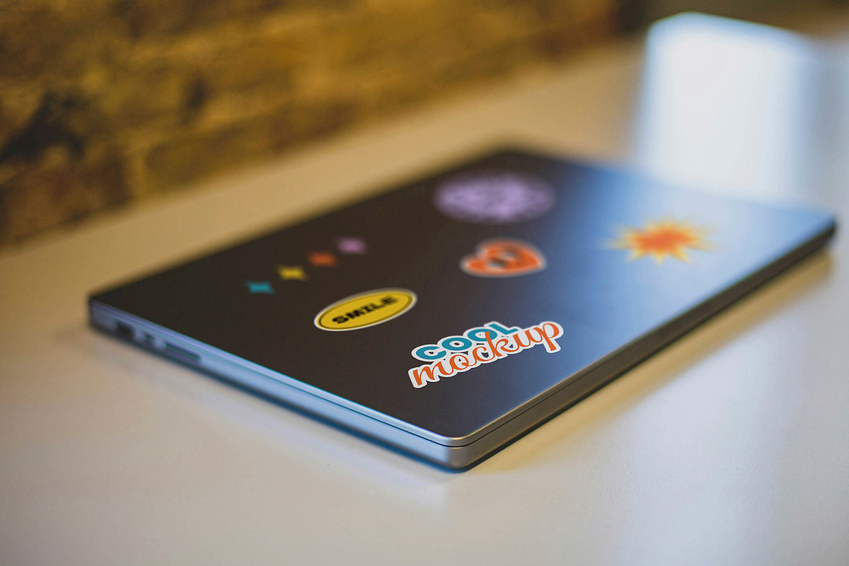 Laptop with Stickers Creation Mockup, a Mockup by Luuqas Design (Photo 2 of 12)
