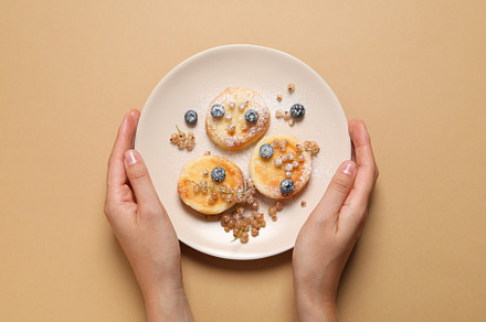 Concept of tasty sweet food, cheese pancakes, top view, a Food & Drink Photo by AtlasStudio PRO