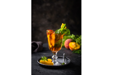 Cold ice tea with peach and mint, a Food & Drink Photo by Yulia Furman