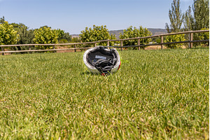 A white helmet on the green grass, a Technology Photo by Illustrations&photos