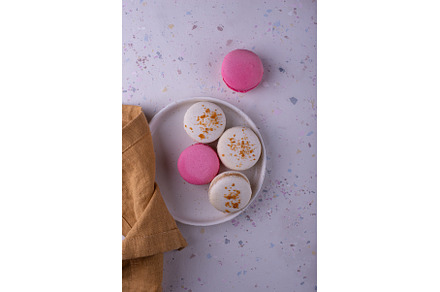 Colorful macaroons on white, a Food & Drink Photo by Yulia Furman