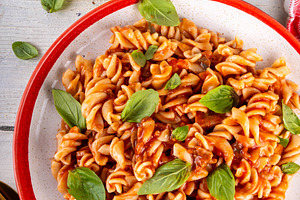Fusilli pasta with bolognese sauce, with ground beef, mushrooms,, a Food & Drink Photo by Rimma