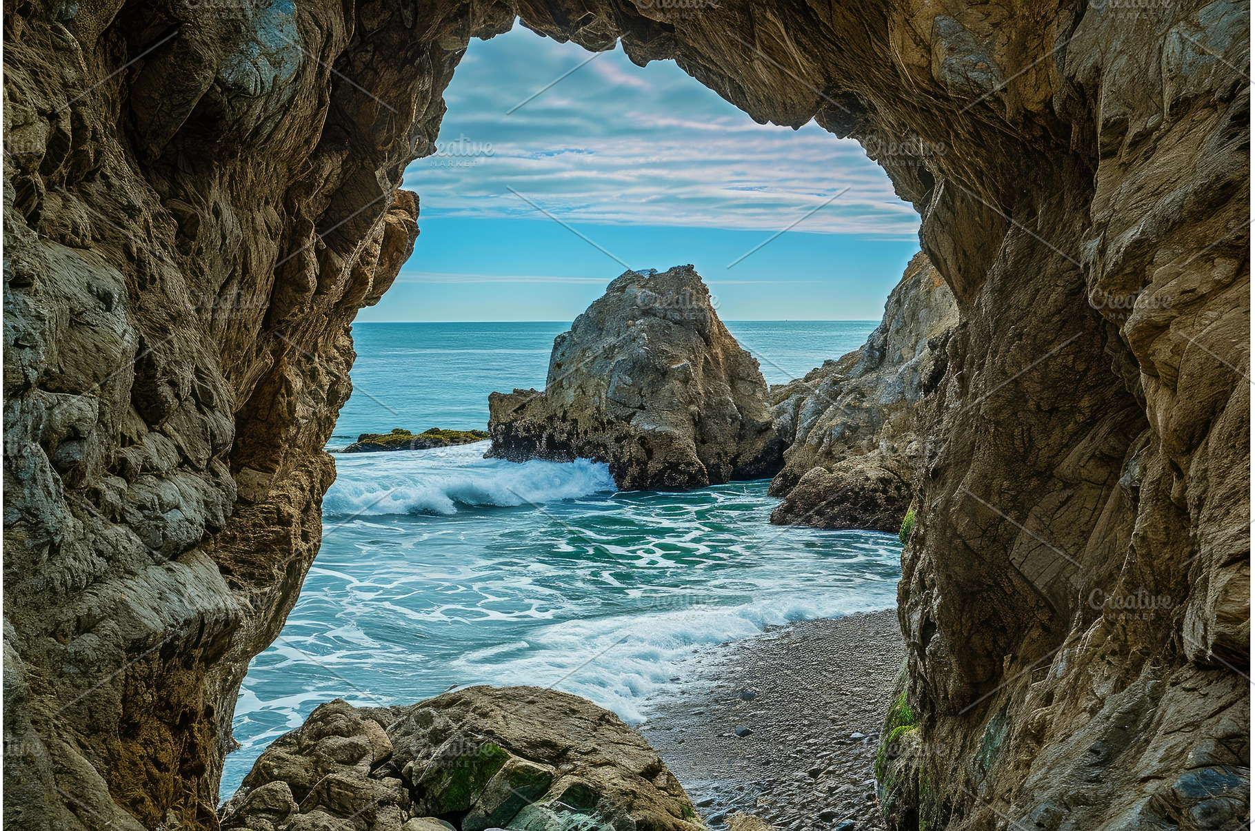 Sea cave view on rocky coastline, a Nature Photo by Ylivdesign