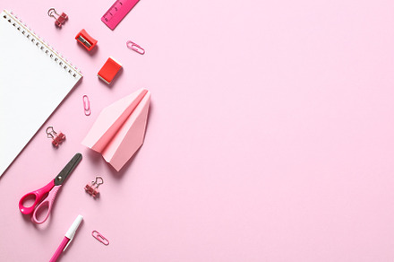 Flat lay school supplies on pink background. Top view table with notepad, sciss, a School & Education Photo by photoguns