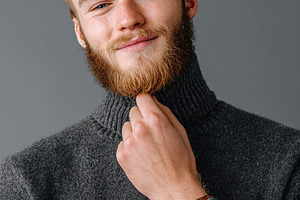 Attractive man in a studio portrait wearing a turtleneck sweater with a confide, a Person Photo by AlyaAnd