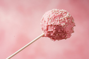 Pink cake pop on a stick, a Photo by Beautiful things