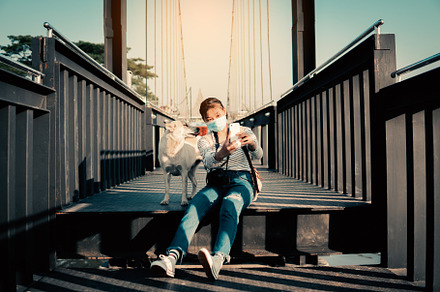 Backpacker sitting with the dog, a Person Photo by sawitree