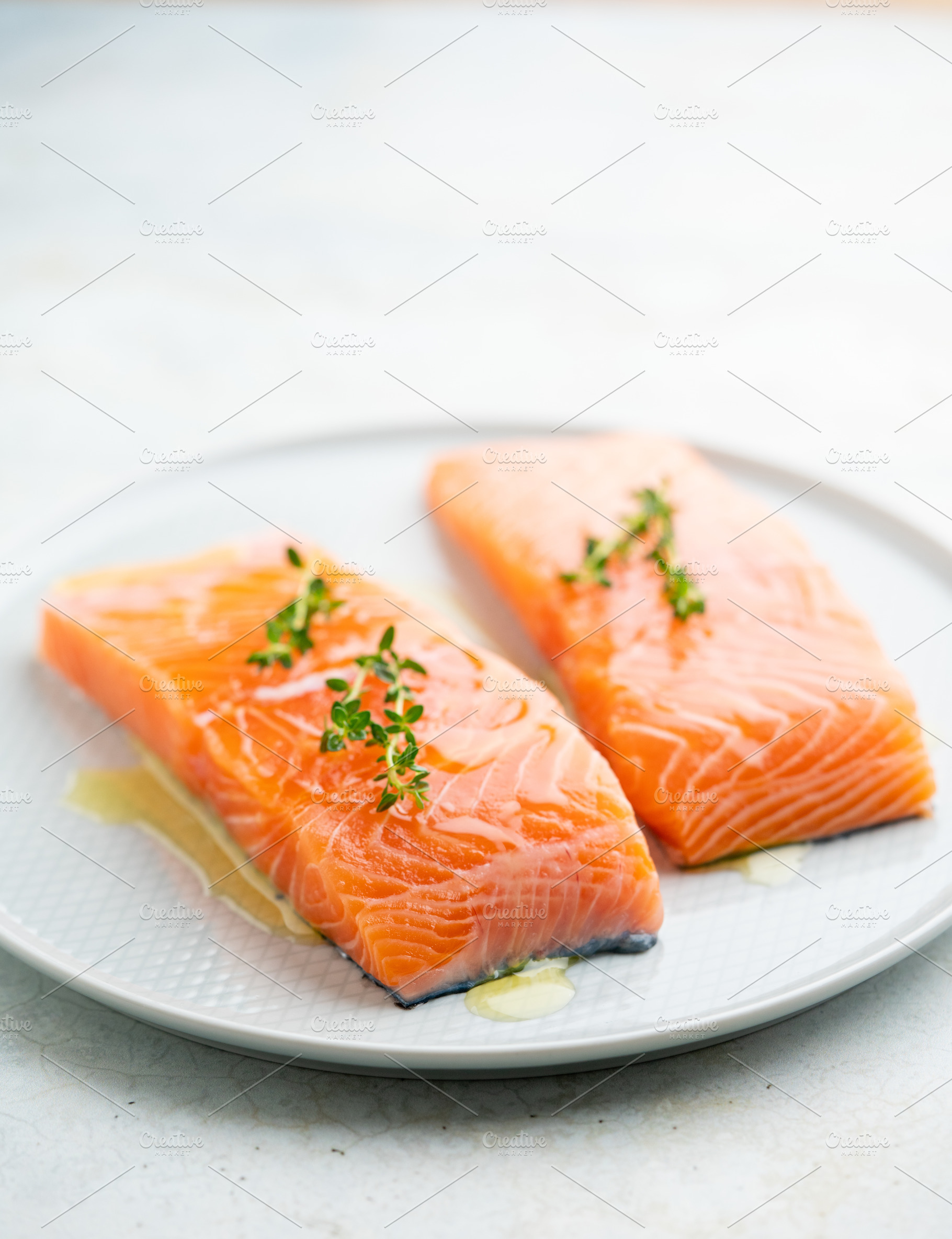 Fresh salmon fillet on a plate for delicious salmon steak., a Food & Drink Photo by FoodStock