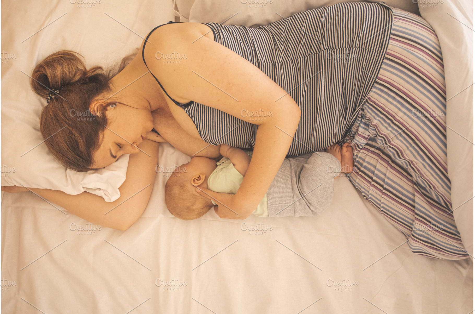 Mother and newborn baby sleep in the, a Beauty & Fashion Photo by oksix