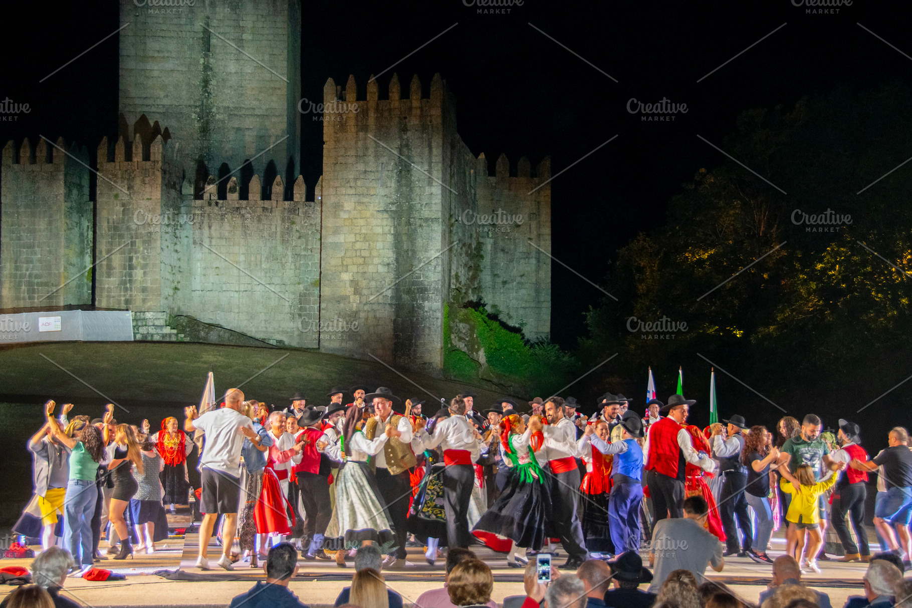 Folk dancers performing at night before medieval castle, an Arts & Entertainment Photo by DanFLCreativo