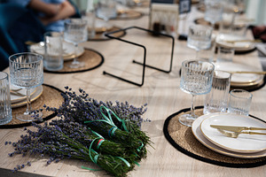 Table set for a meal with lavender decorations and elegant tableware, a Photo by AS photostudio