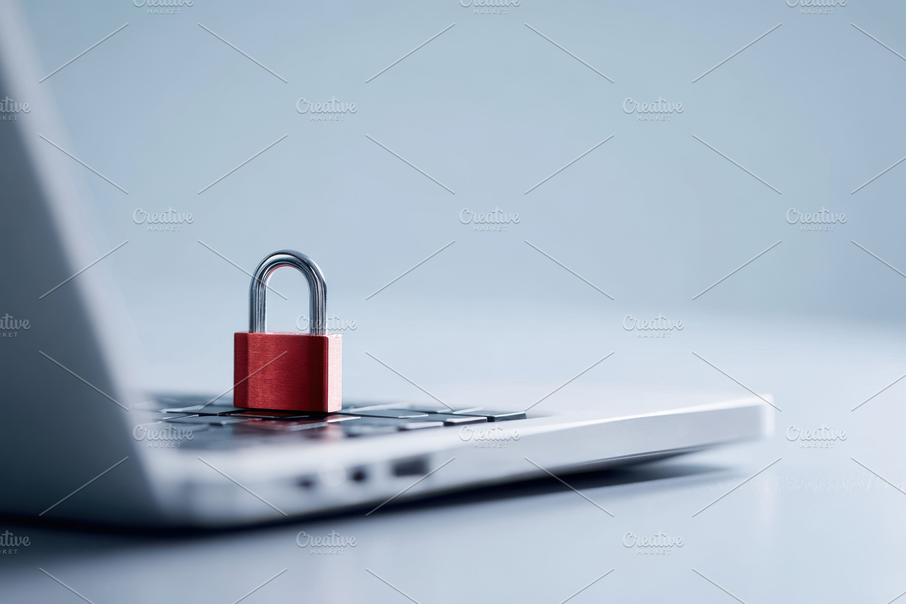 Padlock on laptop keyboard symbolizing security, a Technology Photo by AlyaAnd
