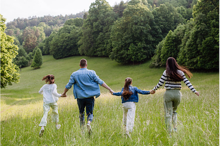 Rear view of beautiful young family, a Person Photo by HalfPoint
